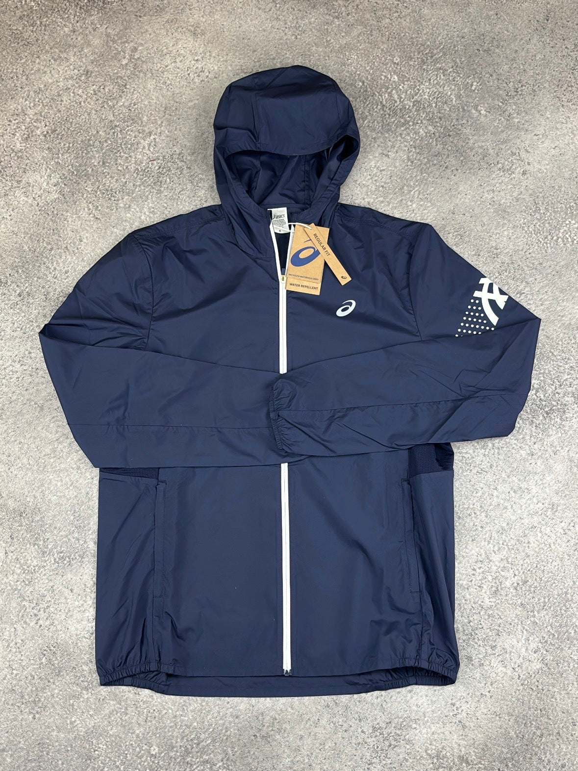 ASICS Icon Jacket Midnight Cream — flat lay front view with tags